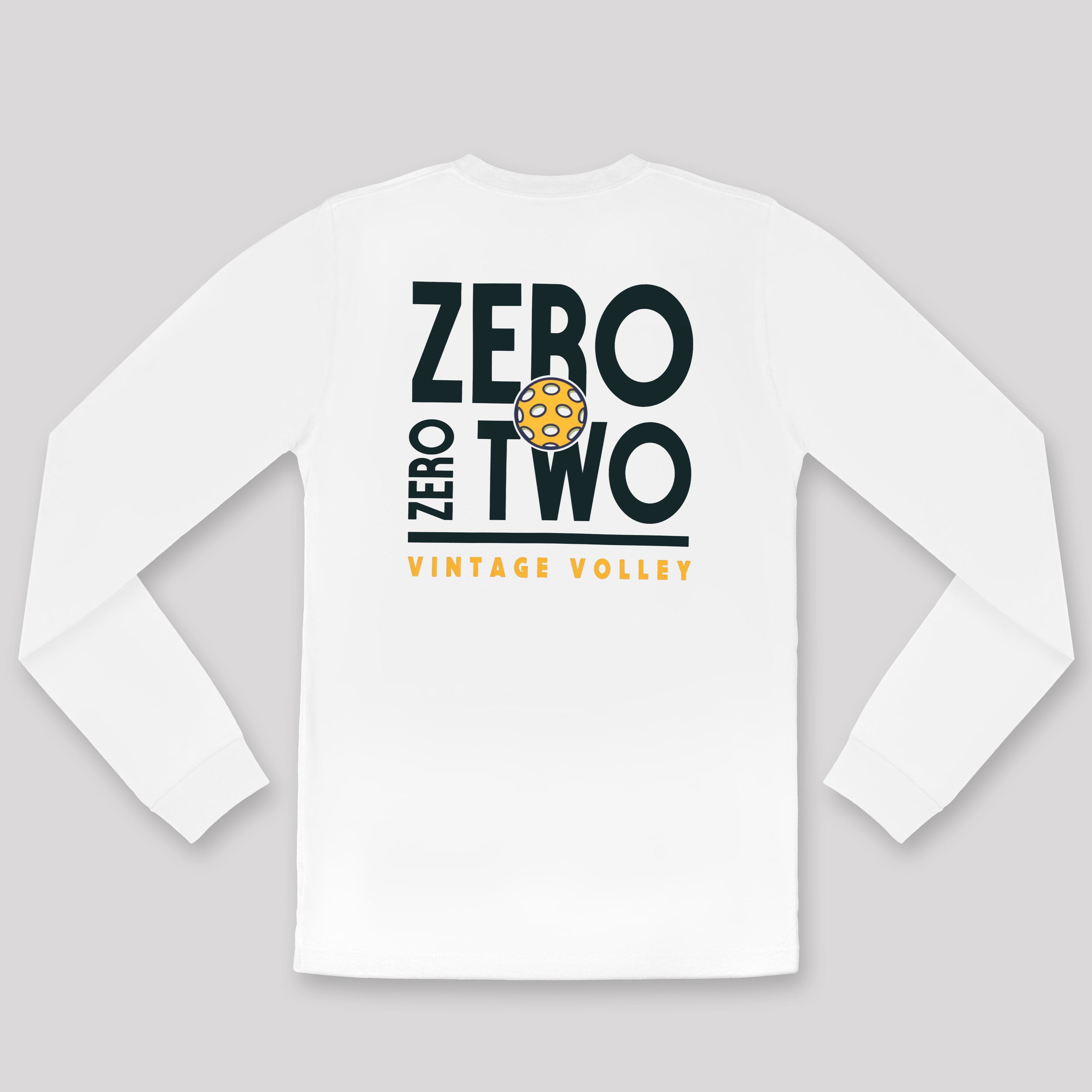 A flat lay of the Zero Zero Two Vintage Volley Long Sleeve Pickleball Shirt in White, highlighting its crisp and minimalist design. The shirt features bold Navy Blue text reading "Zero Zero Two," a vibrant yellow pickleball graphic integrated into the design, and the words "Vintage Volley" in bright yellow below.