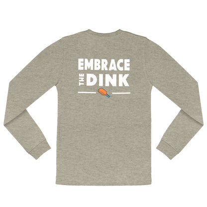 A flat lay of the Embrace the Dink long-sleeve pickleball shirt in Sand, showcasing its minimalist design and lightweight fabric. Ideal for pickleball games or casual wear, this shirt adds versatility to your pickleball outfits.